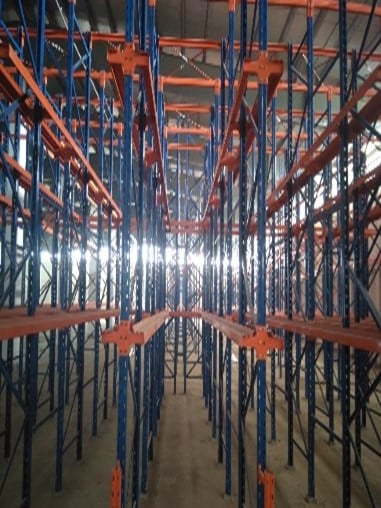 Steel racking bays running the depth of the Payra Port warehouse